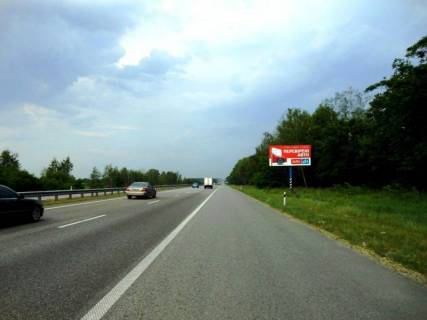 Billboard A in Kiev roads, 6х3  Trasa M-06 "Kiiv-Cop" (Zitomir), km 42+350 livo, cerez 1km pisla povorotu na Motizin, za 1km do povorotu na kotedzne mistecko "Nimec'ka sloboda" Photo 1