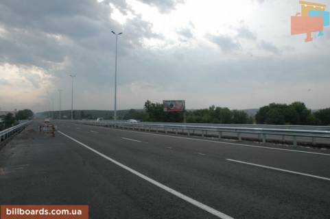 Билборд A в Стоянке, 6х3  с. Стоянка, траса М-06 "Київ-Чоп" (Житомир), км 21+100 право, міст через р. Ірпінка, до розвилки Ірпінь-Гореничі фото 1