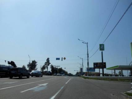 Billboard A in Vishgorod, 6х3  Trasa R-02 "Kiiv-Ivankiv-Ovruc", km 19+000 livo, viizd z m. Visgorod v napramku plosi Sevcenka, cerez 220m pisla povorotu na zavod SANDORA ta HENKEL-Ukraina Photo 1