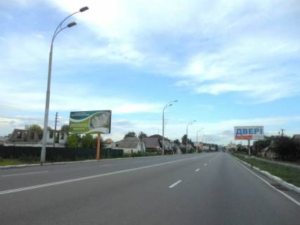 Билборд B в Бровары, 6х3  м. Бровари, вул. Київська, 107, через 280м після повороту на Красницького повіту вул. (кол. Сєрова) та магазину "Фора", через 110м після повороту на вул. Запорізька, за 100м до повороту на вул. Леонтовича, за 130м до повороту на Зазимський шлях (кол. Челюскіна) фото 1