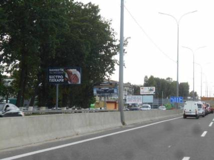Билборд B в Чабаны, 6,20х2,85  с. Чабани, траса М-05 Київ-Одеса, км 14+940 ліво, через 875м після Нової Лінії та магазину АТБ, заїзд у МегаМаркет Гатне, за 70м до автобусної зупинки, за 150м до повороту на Гатне, Крюківщину, Вишневе фото 1