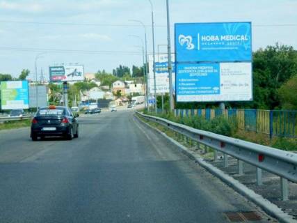 Billboard A in Irpin, 6х3  m. Irpin', trasa M-07 "Kiiv-Kovel'", km 22+975 livo, mist cerez r. Irpinka, cerez 775m pisla rozvilki Irpin'-Gostomel'-Buca, ZK "Gostomel' Rezidens", niz Photo 1