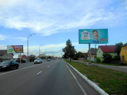 Билборд A в Бровары, 6х3  м. Бровари, вул. Київська, 30, через 200м після магазину "Фора", через 220м після перехрестя з вул. Єсеніна, через 300м після АЗС "КЛО", за 50м до автобусної зупинки, за 90м до поворту на вул. Євгенія Зеленського фото 1