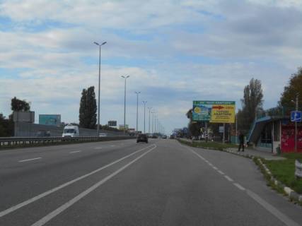 Билборд A в Миле с. Мила, траса М-06 Київ-Чоп (Житомир), км 25+780 право, біля автобусної зупинки, за 400м до магазину "Фора", через 150м після повороту на Дмитрівку фото 1