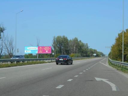 Білборд, Бігборд (Борд)  B у Обухові, 12х3  Дніпровське шосе, траса Н-01 "Київ-Знам'янка", км 43+000 право, через 100м після розв'язки на м. Обухів та м. Українка, виїзд з м. Обухів в сторону м. Київ, правий Фото 1