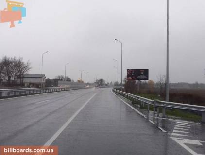 Білборд, Бігборд (Борд)  A у Києві, 6х3  с. Таценки, шосе Дніпровське (шосе Дніпропетровське), траса Н-01 "Київ-Знам'янка", км 40+030 право, біля автобусної зупинки, перед мостом через р. Стугна Фото 1