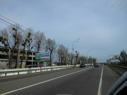 Білборд, Бігборд (Борд)  B у Нових Петрівцях, 6х3  Траса "Київ-Іванків-Овруч", Р-02 км 20 + 500 ліво, с. Нові Петрівці, поворот на на комплекс "Межигір'я" Фото 1