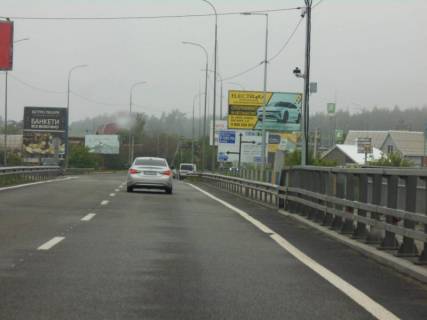 Билборд A в Ирпене, 6х3  м. Ірпінь, траса М-07 "Київ-Ковель", км 23+300 право, міст через р. Ірпінка, в'їзд у місто, за 275м до АЗС ОККО, через 500м після магазину АТБ, через 550м після магазину ФОРА фото 1