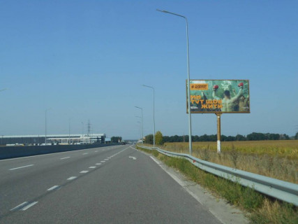 Билборд A в Бровары, 6х3  Траса М-01 "Київ-Чернігів-Нові Яриловичі", км 24+600 ліво, об'їзд м. Бровари, за 1.4км до перетину Переяславський шлях (кол. Осипова) та вул. Лагунової, ресторану "Петрівський Бровар" та АЗС ОККО, через 900м після повороту на трасу Р-03 (Північно-Східний фото 1