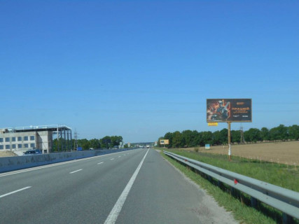 Билборд A в Бровары, 6х3  Траса М-01 "Київ-Чернігів-Нові Яриловичі", км 24+200 ліво, об'їзд м. Бровари, за 1км до перетину Переяславський шлях (кол. Осипова) та вул. Лагунової, ресторану "Петрівський Бровар" та АЗС ОККО, через 1.3км після повороту на трасу Р-03 (Північно-Східний фото 1