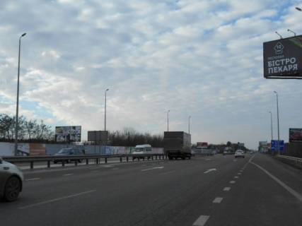 Билборд B в Миле с. Мила, траса М-06 Київ-Чоп (Житомир), км 26+950 ліво, за 150м після ресторану "Два Бобра", 475м до АЗС GLUSCO фото 1
