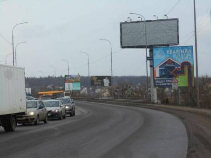 Білборд, Бігборд (Борд)  A у Ірпені м. Ірпінь, траса М-07, км 23+400 ліво, вул. Свято-Покровська, 2а, перед мостом через р. Ірпінка, навпроти офісу ЖК "Гостомель Резіденс", через 150м після АЗС ОККО, верх Фото 1