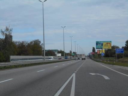 Билборд A в Миле с. Мила, траса М-06 Київ-Чоп (Житомир), км 26+650 ліво, за 400м до магазину "Фора", ЖК Милі Квавртири, біля садового центру  фото 1