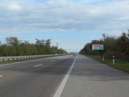 Billboard A in Kyiv trasa M-06 Kiiv-Cop (Zitomir), km 42+850 livo, cerez 650m pisla povorotu na Motizin, povorot na kotedzne mistecko "Nimec'ka sloboda" Photo 1