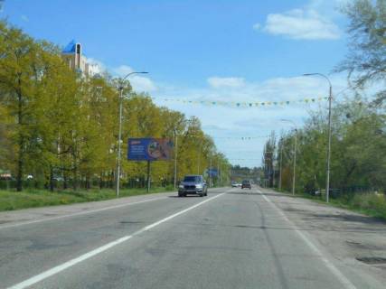 Билборд A в Буче, 6х3  м. Буча, траса М-07 "Київ-Ковель", км 29+100 право, вул. Нове Шосе, 18, перехрестя з бульваром Богдана Хмельницького, в напрямку до ТЦ Модуль, Нова Лінія фото 1