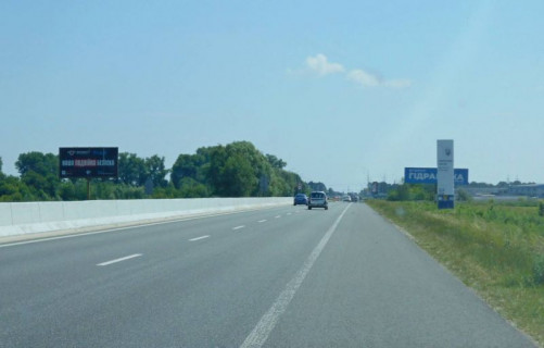 Білборд, Бігборд (Борд)  B у Бровари, 6х3  м. Бровари, траса М-01 "Київ-Чернігів-Нові Яриловичі", км 22+550 ліво, об'їзд м. Бровари, за 750м до перетину Переяславський шлях (кол. Осипова) та вул. Лагунової, ресторану "Петрівський Бровар" та АЗС ОККО, через 1.7км після повороту на вул. Анатолія Фото 1