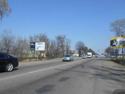 Білборд, Бігборд (Борд)  B у Бучі м. Буча, траса М-07, км 30+150 право, вул. Нове Шосе, перехрестя з вул. Депутатська, за ТЦ Модуль, навпроти ЖК "Варшавський", ЖК "Буча-Квартал" Фото 1