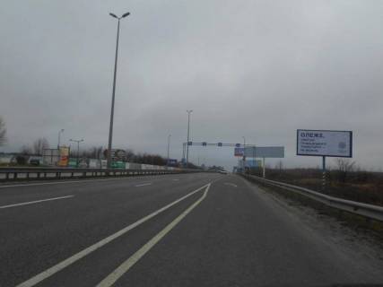 Білборд, Бігборд (Борд)  A на трасах Київської області, 6х3  с. Мила, траса М-06 "Київ-Чоп" (Житомир), км 26+700 право, за 650м перед  АЗС GLUSCO, навпроти ресторану "Два бобра" Фото 1