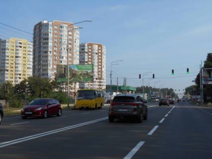 Білборд, Бігборд (Борд)  B у Бровари м. Бровари, вул. Київська, біля автобусної зупинки та магазину АТБ, за 75м до АЗС WOG та 95м до повороту на вул. Василя Стефаника, через 85м після заїзду на ринок та магазину Varus Фото 1