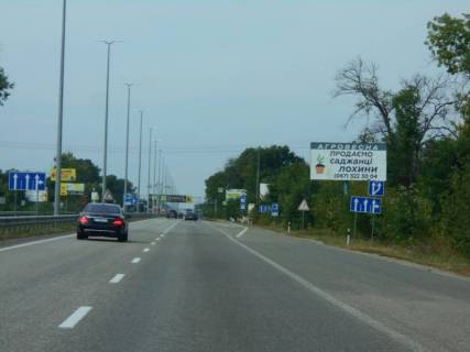 Билборд A в Копилів (Київська обл.), 6х3  траса М-06 "Київ-Чоп" (Житомир), км 45+000 право, митні склади, завод "Ruukki", перед рестораном "Шашличний Двір", Київська Регіональна Митниця фото 4