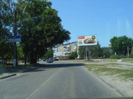 Билборд A в Обухове, 6х3  м. Обухів, вул. Каштанова, 22, біля монастиря, за 100м до автобусної зупинки фото 1