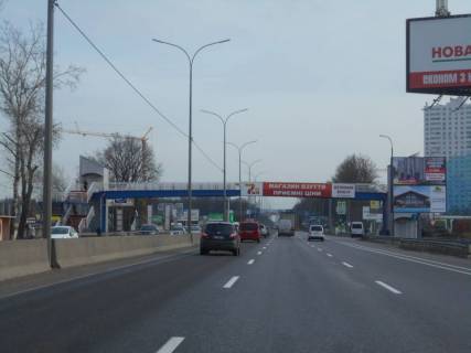Білборд, Бігборд (Борд)  A у Києві м. Київ, проспект Академіка Глушкова, траса М-05 Київ-Одеса, км 13+930 ліво, навпроти магазину АТБ, виїзд з Нової Лінії, за 130м до АЗС ОККО, верх Фото 1
