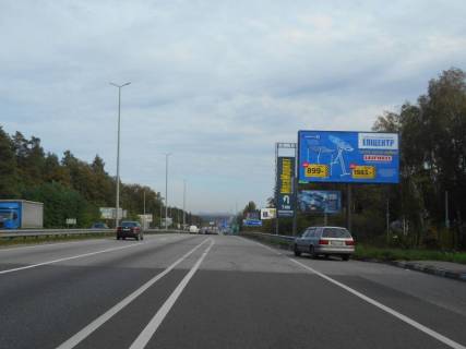 Білборд, Бігборд (Борд)  A у Капітанівке, 6х3  с. Капітанівка, траса М-06 "Київ-Чоп" (Житомир), км 24+120 ліво, перед розворотом на Бучу, автобусна зупинка Капітанівка Фото 1