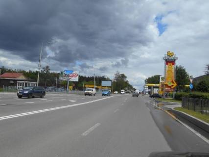 Білборд, Бігборд (Борд)  B у Бровари, 6х3  м. Бровари, вул. Київська, навпроти ТРЦ "Термінал" та магазину "МегаМаркет", через 95м після розвилки з вул. Павла Чубинського та Петлюри Симона вул. (кол. Черняховського), через 245м після повороту на вул. Василя Стефаника, через 265м після АЗС "WOG", за 60м до АЗС Фото 1