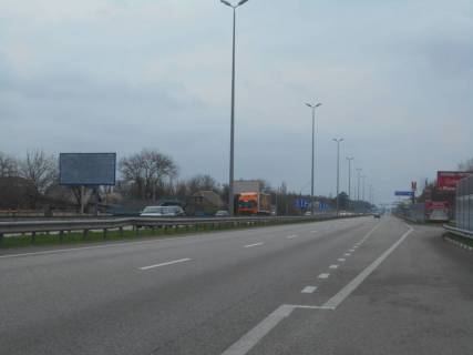 Билборд B в Миле, 6х3  с. Мила, траса М-06 "Київ-Чоп" (Житомир), км 25+780 право, біля автобусної зупинки, через 400м після магазину "Фора", за 150м до повороту на Дмитрівку фото 1