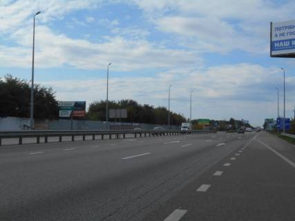Білборд, Бігборд (Борд)  B у Міла с. Мила, траса М-06 Київ-Чоп (Житомир), км 26+950 ліво, через 150м після ресторану "Два Бобра", за 475м до АЗС GLUSCO Фото 1