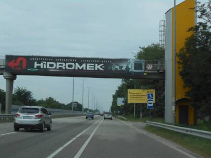 Билборд A в Мрії, 6х3  с. Мрія, траса М-06 "Київ-Чоп" (Житомир), км 28+950 право, автобусна зупинка фото 1
