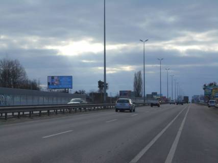 Білборд, Бігборд (Борд)  B на трасах Київської області, 6х3  с. Мила, траса М-06 "Київ-Чоп" (Житомир), км 25+770 ліво, біля автобусної зупинки, за 400м до магазину "Фора", поворот на Дмитрівку Фото 1