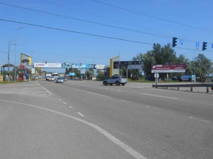 Білборд, Бігборд (Борд)  A у Ходосівці, 12х3  Дніпровське шосе, траса Н-01 "Київ-Знам'янка", км 23+650 ліво, поворот на с. Ходосівку, біля АЗС UPG, через 150м після ТЦ "МегаМаркет", лівий Фото 1